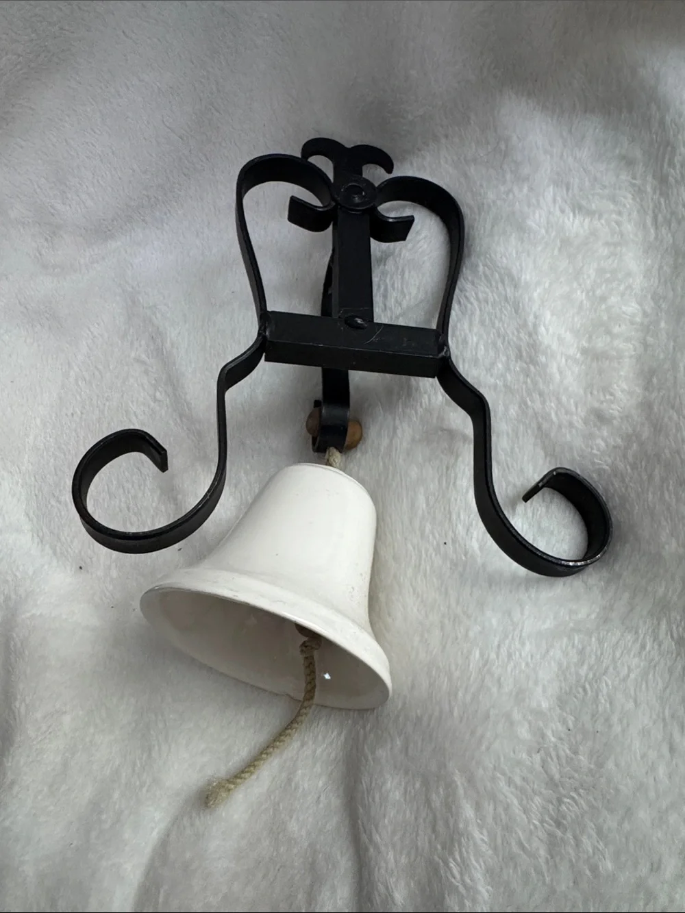 White Ceramic Bell Wall Decor with Black Iron Bracket